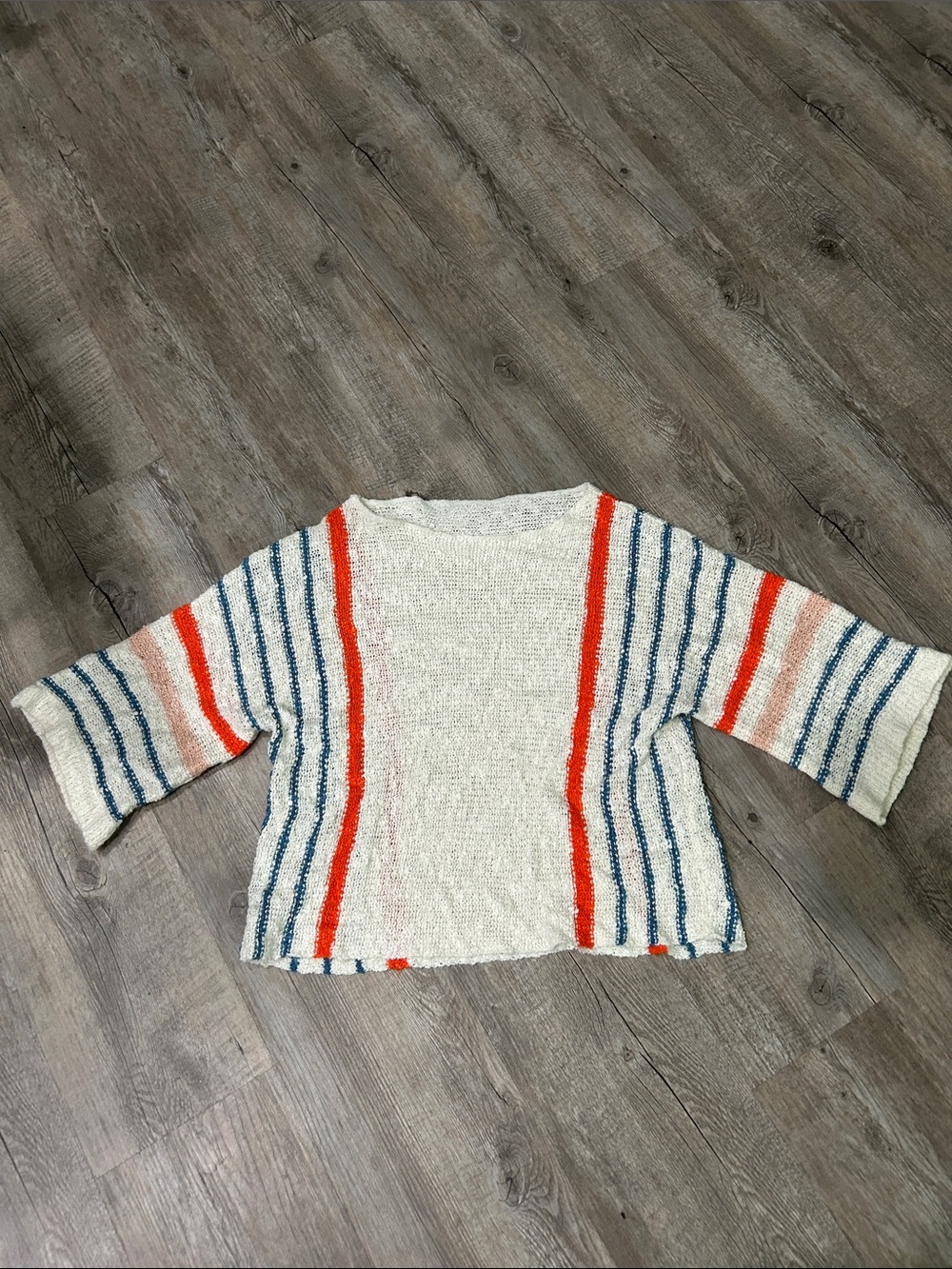 Striped Open-Weave Cream Sweater with Red and Blue Accents